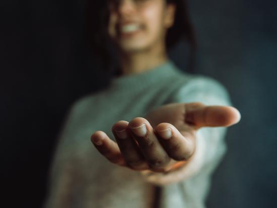 A woman extends a helping hand.